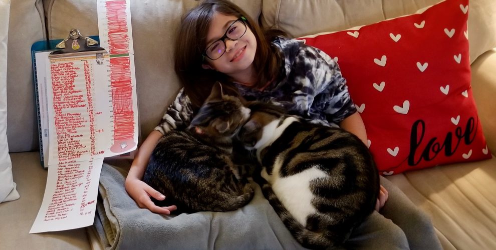 girl smiling with cats