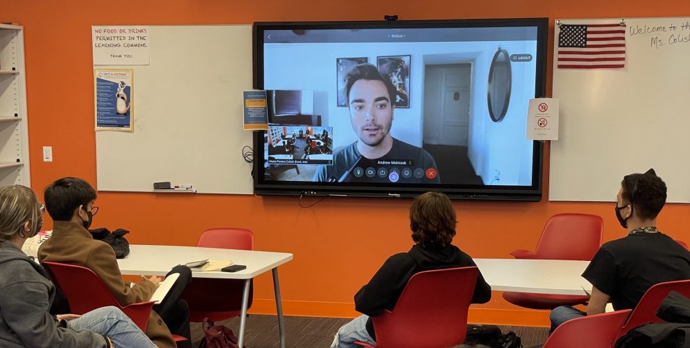 students meeting with gaming expert via video conference