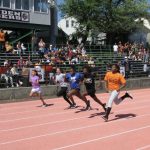 students running race on track