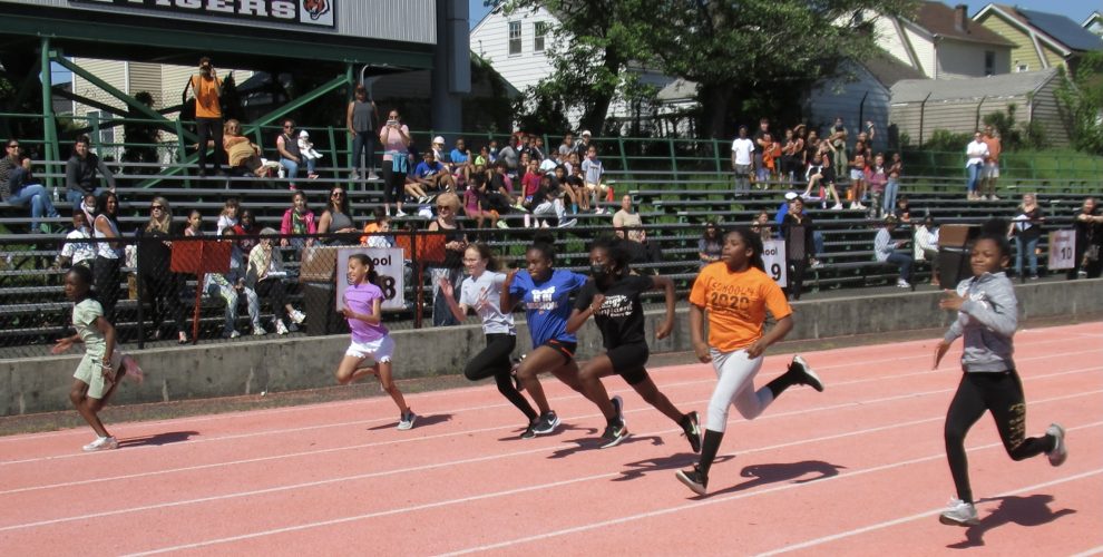students running race on track